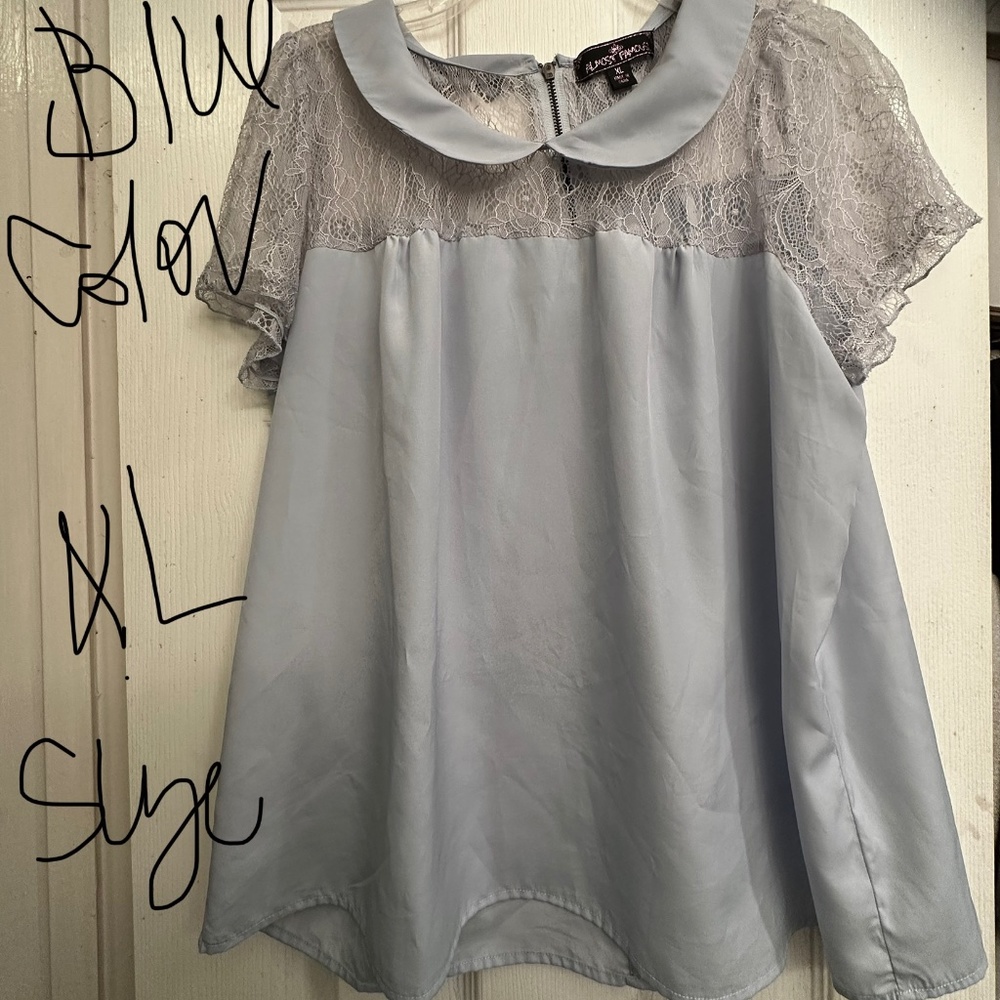Such a beautiful, feminine powder baby blue top with a hint of lace and elegance